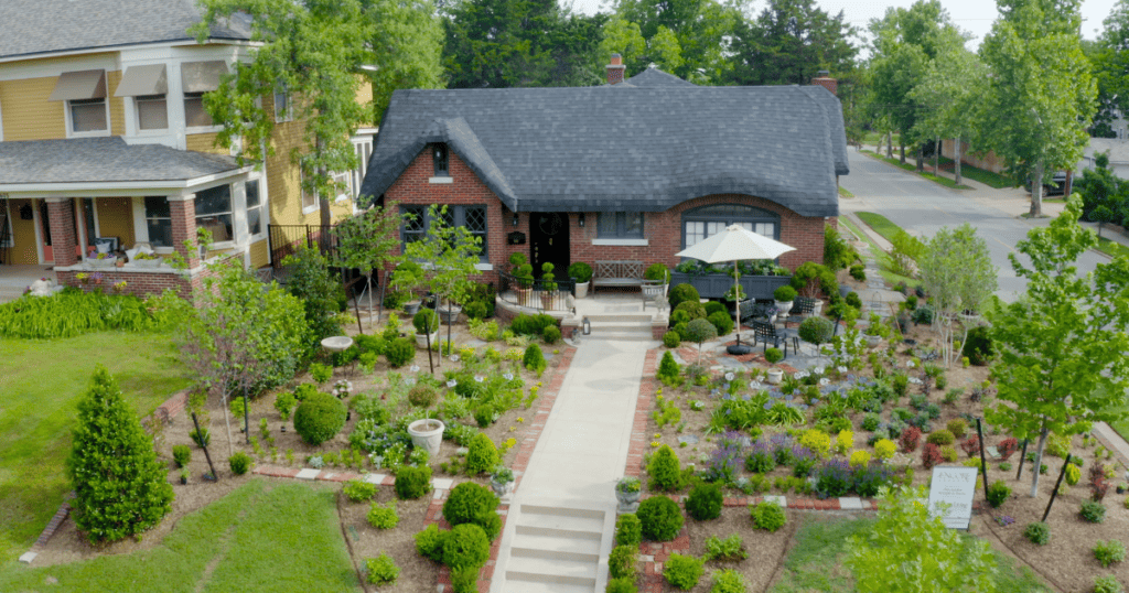 An aerial view of a house in a neighborhood.